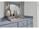 Wet bar with light gray cabinetry and a mirrored backdrop in the main living area at 123 Golf Club Dr, Longwood, FL 32779