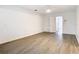 Simple bedroom with grey wood-look floors and ceiling fan at 123 Golf Club Dr, Longwood, FL 32779