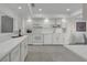 Bright kitchen featuring tile floors, ample white cabinetry, countertops and stainless steel appliances at 123 Golf Club Dr, Longwood, FL 32779