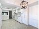 Updated white kitchen with stainless steel appliances and tile floors at 123 Golf Club Dr, Longwood, FL 32779