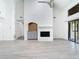 Living room with whitewashed brick fireplace and hardwood floors at 123 Golf Club Dr, Longwood, FL 32779