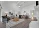 Bright living room with a fireplace, ceiling fan, and luxury vinyl flooring at 123 Golf Club Dr, Longwood, FL 32779