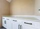 White built-in cabinets with quartz countertop in sunroom at 123 Golf Club Dr, Longwood, FL 32779