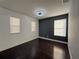 Bedroom featuring a modern light fixture and two windows at 13124 Oulton Cir, Orlando, FL 32832