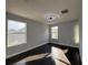 Light-filled bedroom with hardwood floors, and modern ceiling fan at 13124 Oulton Cir, Orlando, FL 32832