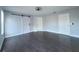 Bedroom featuring hardwood floors, neutral walls, barn door closet and three windows at 13124 Oulton Cir, Orlando, FL 32832