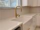 Close-up of kitchen sink, faucet and quartz countertops at 13124 Oulton Cir, Orlando, FL 32832