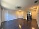 Second floor landing with hardwood floors and multiple bedroom doors at 13124 Oulton Cir, Orlando, FL 32832