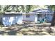 Backyard with shed, patio, and mature trees at 1338 S Elliott St, Sanford, FL 32771