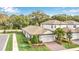 Aerial view of a charming house with a two-car garage and well-maintained landscaping at 1401 Lone Feather Trl, Winter Park, FL 32792