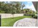 Landscaped backyard with a spacious patio and privacy fence at 1401 Lone Feather Trl, Winter Park, FL 32792