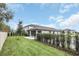 Landscaped backyard with a grassy lawn and privacy fence at 1401 Lone Feather Trl, Winter Park, FL 32792