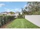 Fenced backyard with a grassy area and privacy fence at 1401 Lone Feather Trl, Winter Park, FL 32792