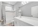 Clean bathroom with white vanity, bathtub, and updated fixtures at 1401 Lone Feather Trl, Winter Park, FL 32792