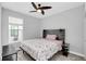 Spacious bedroom with a rustic wood headboard and ceiling fan at 1401 Lone Feather Trl, Winter Park, FL 32792