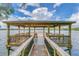 Lakefront gazebo with wooden deck and seating at 1401 Lone Feather Trl, Winter Park, FL 32792