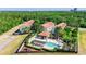 Aerial view of community with pool and surrounding buildings at 14531 Damai Ln, Orlando, FL 32821