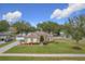 One-story house with green exterior,landscaped yard, driveway at 1511 Dunn Cove Dr, Apopka, FL 32703