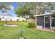 Landscaped backyard with a circular garden and patio at 1511 Dunn Cove Dr, Apopka, FL 32703