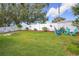 Backyard with hammock, chairs, and lush grass at 1511 Dunn Cove Dr, Apopka, FL 32703