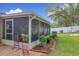 Screened patio with potted plants and a manicured lawn at 1511 Dunn Cove Dr, Apopka, FL 32703