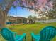 Spacious backyard with patio, lawn, and seating area at sunset at 1511 Dunn Cove Dr, Apopka, FL 32703