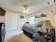 Cozy bedroom with double bed, ceiling fan, and window at 1511 Dunn Cove Dr, Apopka, FL 32703