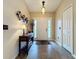 Bright entryway with tile floors and console table at 1511 Dunn Cove Dr, Apopka, FL 32703