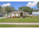 One-story house with green exterior,red door,landscaped yard at 1511 Dunn Cove Dr, Apopka, FL 32703