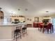 Open concept kitchen with dining area and ample cabinet space at 1511 Dunn Cove Dr, Apopka, FL 32703