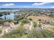 Wide aerial view of neighborhood with lake at 1511 Dunn Cove Dr, Apopka, FL 32703