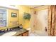 Clean bathroom with a tub, shower, and granite countertop at 1513 Ocean Shore Blvd # 8F, Ormond Beach, FL 32176