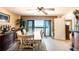 Elegant dining area with ocean views, a large table, and access to a balcony at 1513 Ocean Shore Blvd # 8F, Ormond Beach, FL 32176