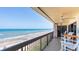 Relaxing oceanfront balcony with seating and ceiling fan at 1513 Ocean Shore Blvd # 8F, Ormond Beach, FL 32176