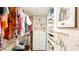 Spacious walk-in closet with custom shelving and drawers at 1513 Ocean Shore Blvd # 8F, Ormond Beach, FL 32176