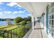 Balcony overlooking lake with wrought iron railing and tile flooring at 1522 Lake Knowles Cir, Winter Park, FL 32789