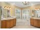 Elegant bathroom with double vanity and soaking tub at 1522 Lake Knowles Cir, Winter Park, FL 32789