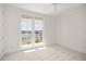 Bedroom with French doors opening to a lake view at 1522 Lake Knowles Cir, Winter Park, FL 32789