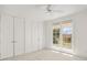 Bright bedroom with double doors leading to balcony at 1522 Lake Knowles Cir, Winter Park, FL 32789