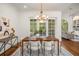 Elegant dining room with wood table and chairs, access to backyard at 1522 Lake Knowles Cir, Winter Park, FL 32789