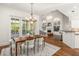 Bright dining room features a wood table, French doors, and a chandelier at 1522 Lake Knowles Cir, Winter Park, FL 32789