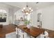 Spacious dining area with hardwood floors and kitchen views at 1522 Lake Knowles Cir, Winter Park, FL 32789