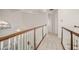 Upper hallway with hardwood floors and white railings at 1522 Lake Knowles Cir, Winter Park, FL 32789