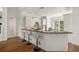 Modern kitchen with white cabinets, granite counters, and breakfast bar at 1522 Lake Knowles Cir, Winter Park, FL 32789