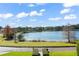 Scenic lakefront view with lush landscaping and homes at 1522 Lake Knowles Cir, Winter Park, FL 32789