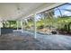 Covered patio with pool and spa, surrounded by lush landscaping at 1522 Lake Knowles Cir, Winter Park, FL 32789