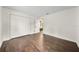 Bright bedroom with dark hardwood floors and double closets at 1523 N Beach St, Ormond Beach, FL 32174