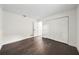 Bedroom featuring dark hardwood floors and white walls at 1523 N Beach St, Ormond Beach, FL 32174