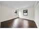 Simple bedroom with dark hardwood floors and double closets at 1523 N Beach St, Ormond Beach, FL 32174