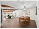 Open dining room with wood table and exposed beams at 1523 N Beach St, Ormond Beach, FL 32174